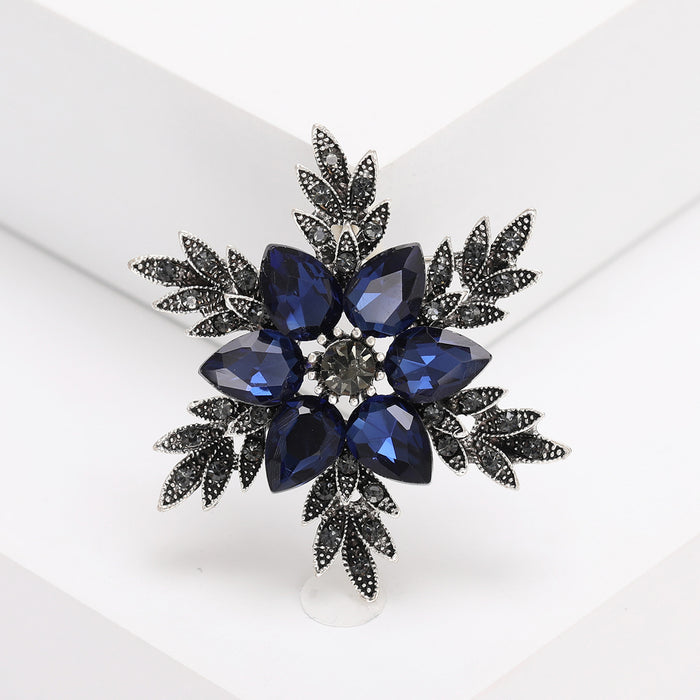Deep Blue Crystal Flower Cluster Brooch With Dark Leaves