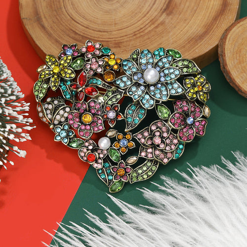 Multicolor Floral Heart brooch With Crystals And Pearl shown in styled product arrangement