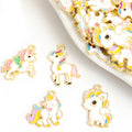 Playful White Enamel Unicorn Charms in Four Distinct Poses view 1