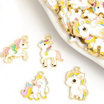 Front assortment of white unicorn figures with pastel manes and gold-tone outlines
