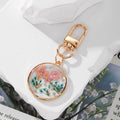 Gold Tone Round Pressed Flower and Fish Clip Keychains view 2