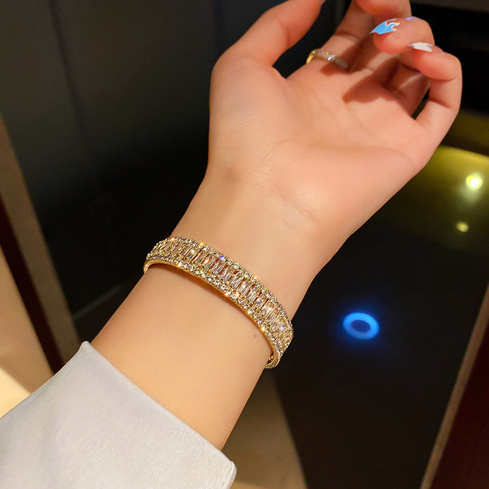 Gold Tone Open Cuff Bracelet With Clear Baguette Stones