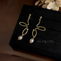Abstract Gold Wire Butterfly Dangle Earrings Pearl Drop view 1