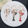 White Black and Red Dress Mannequin Metal Keychain Set view 1