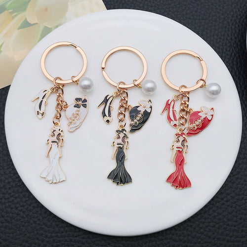 Overview showing the available color and design variations of the white black and red dress mannequin metal keychain
