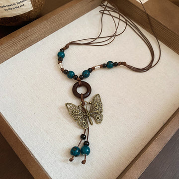 Brown Cord Butterfly Metal Pendant Teal Ceramic Beads