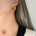 Twisted Chunky Hoop Earrings Gold and Steel Finishes view 3