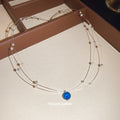 Silver Tone Double Strand Necklace With Blue Round Pendant view 2