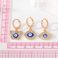 Gold Tone Crystal Blue Evil Eye Huggie Earrings in Three Shapes view 4