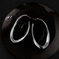Polished Elongated Oval Hoop Earrings in Gold and Silver view 7