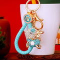 Gold Tone Crystal Sitting Deer Keychains in Ten Color and Strap Options view 11