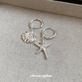 Silver Tone Starfish And Shell Huggie Earrings With Polished Metal Details view 2