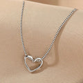 Interlocking Open Heart Pendant Necklace in Gold Tone Finish view 5