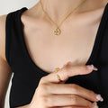 Hollow Xi Round Pendant Necklace Gold Rose Steel Tones view 1