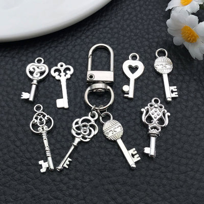 Metallic assorted shape charms shown in a close-up product view