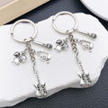 Silver Tone Guitar Drum and Saxophone Music Keychains view 1