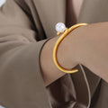 Open Twist Cuff Bracelet With White Pearl Gold Steel view 1