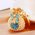 Pearl Heart Fortune Pouch Keychains in Eight Pictured Enamel Colors view 2