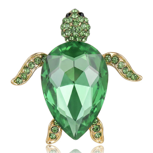 Green crystal sea turtle brooch gold-tone front on white