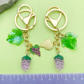 Strawberry, Cherry and Lemon Charm Keychains Featuring Purple Grape Across 43 Variations view 2