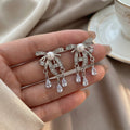 Silver Bow Crystal Look Chain Teardrop Stud Earrings view 2