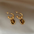 Gold Tone Oval Brown Cabochon Drop Earrings with Curled Frames view 3