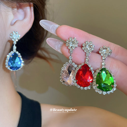 Colorful Teardrop Crystal Flower Drop earrings shown in a close handheld view.