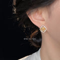 Gold Tone Fleur De Lis And Clear Stone Octagon Halo Stud Earrings view 2