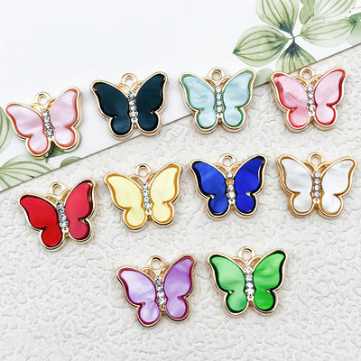 Colorful butterfly charms arranged on a light background