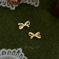 Gold Bow Stud Earrings Clear Pave Stones Star Cutouts view 4