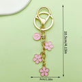 Gold-Tone Initial Letter Keychain With Three Flower Charms view 6