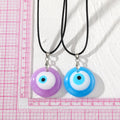 Round Resin Evil Eye Pendant Necklaces on Black Cords view 4