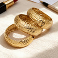 Gold Steel Wide Sunburst Cuff And Textured Hinge Bangles view 3