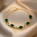 Gold Tone Bracelet With Green Oval Stones And Crystal Flowers view 6