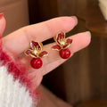 Floral Stud Earrings with Pearl Drops in Brown or Red view 3