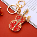 Red Crystal Butterfly Guitar Keychain with Gold Tone Hardware view 1