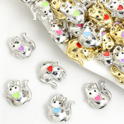 Assorted elephant charms arranged beside a mixed pile
