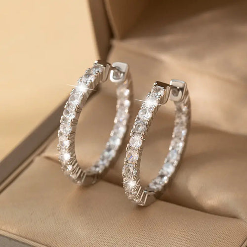 Product view showing round clear-stone hoop earrings
