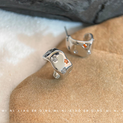 Silver C hoops with orange and clear star CZ on beige stone