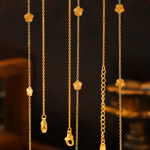 Gold flower station chains hanging vertical showing clasp details