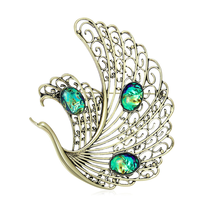 Openwork Swan Brooch In Metal With Filigree Wings And Three Iridescent Cabochons