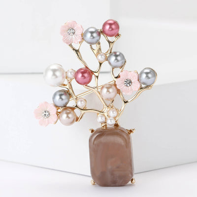 Pearl Blossom Brown Vase Brooch shown against a white display background