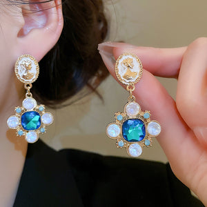 Blue Crystal Floral Cameo Drop Earrings With Polished Metal Details