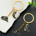 Black Western Hat and Boot Star Metal Keychain Set view 1