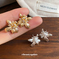 Layered Floral Crystal Stud Earrings in Gold and Silver Tones view 4