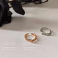 Crossed Open Rings In Polished Silver And Gold Tone view 4