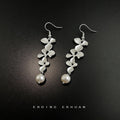 Silver Tone Long Leaf Branch And White Pearl Hook Earrings view 3