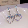 Crystal Bow and Open Heart Drop Stud Earrings With Metal Details view 6