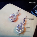 Silver Tone Pear Drop Earrings with Clear Stone Halos view 5