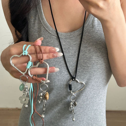 Black Cord Heart Dog Charm product displayed in a styled close-up